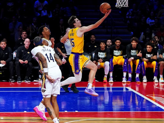 Los Angeles Lakers guard Austin Reaves shoots the ball against New Orleans Pelicans forward Brandon Ingram on December 7, 2023 Los Angeles Lakers guard Austin Reaves shoots the ball against New Orleans Pelicans forward Brandon Ingram on December 7, 2023