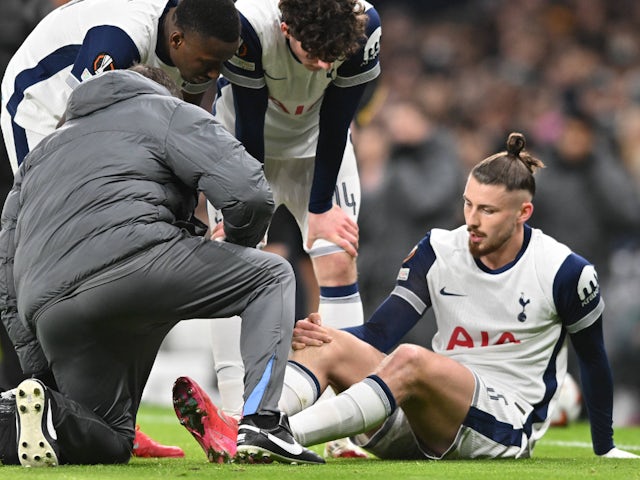 Tottenham Hotspur's Radu Dragusin receives treatment for an injury on January 30, 2025 Tottenham Hotspur's Radu Dragusin receives treatment for an injury on January 30, 2025