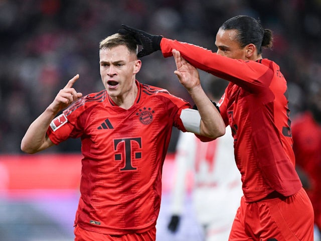 Bayern Munich's Joshua Kimmich celebrates with Leroy Sane on December 20, 2024 Bayern Munich's Joshua Kimmich celebrates with Leroy Sane on December 20, 2024