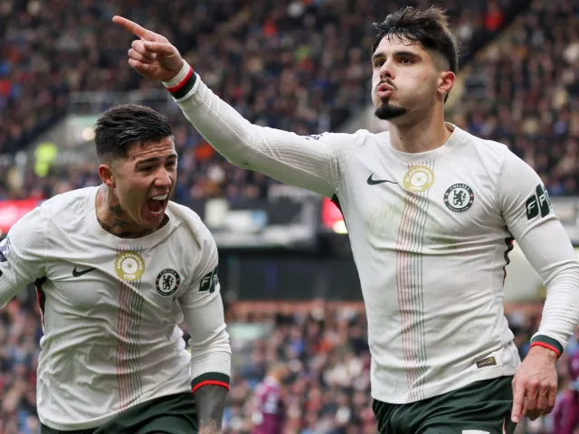 Pedro Neto celebrates with Enzo Fernandez after scoring for Chelsea on November 22, 2025